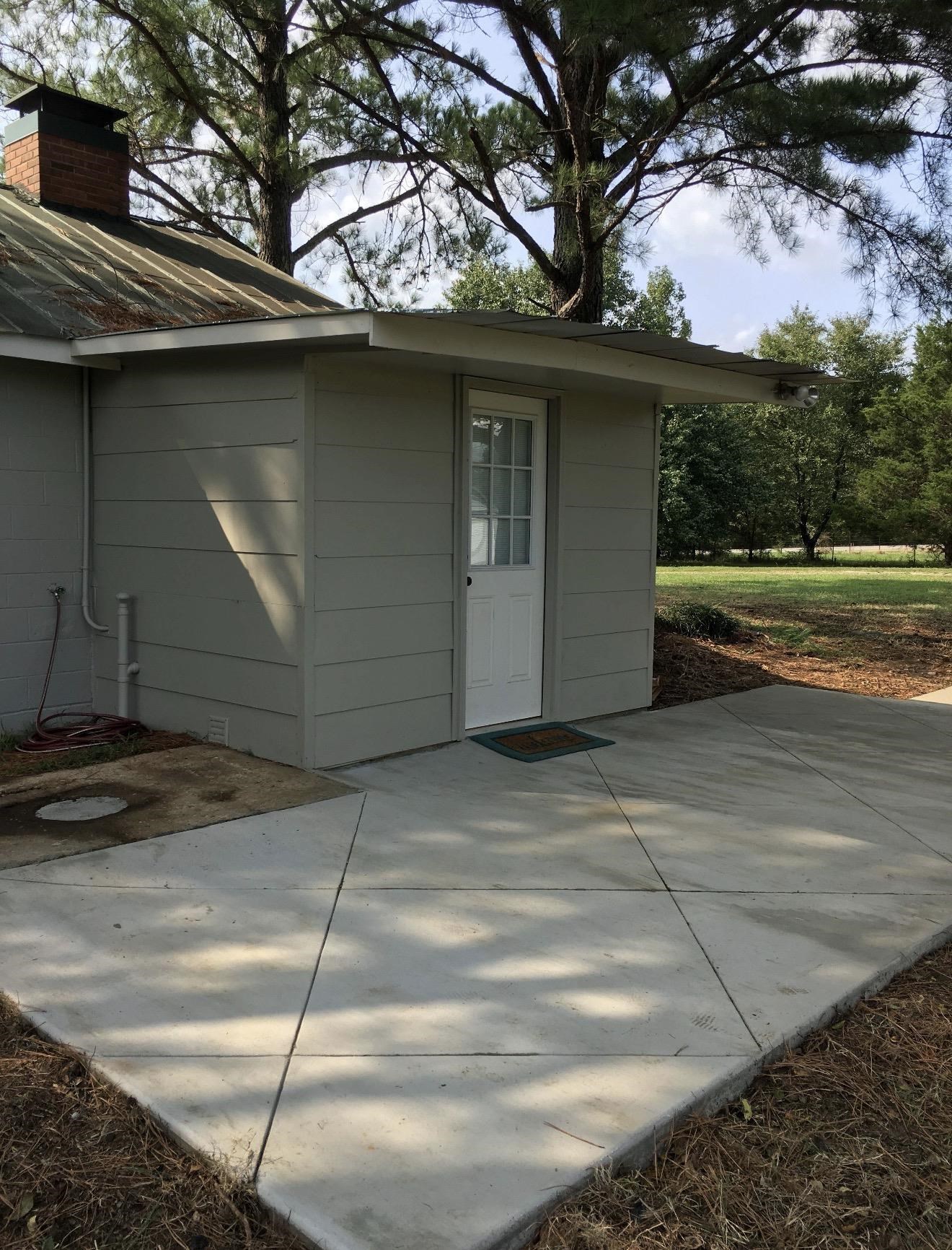 105 Bateman Road Moscow, TN 38057 - Photo 3 of 26 a view of backyard with a garden and trees