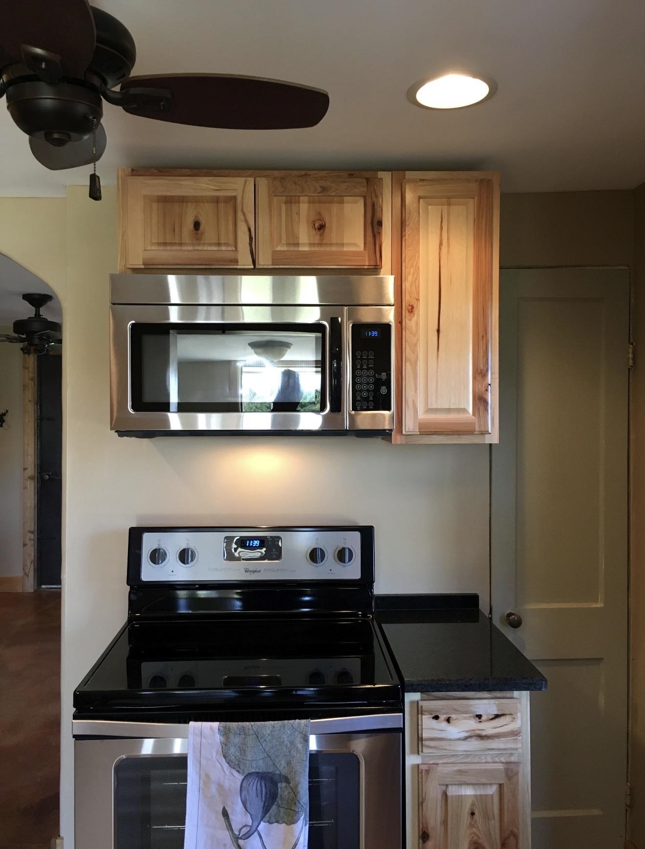 105 Bateman Road Moscow, TN 38057 - Photo 5 of 26 a kitchen with a stove and a microwave