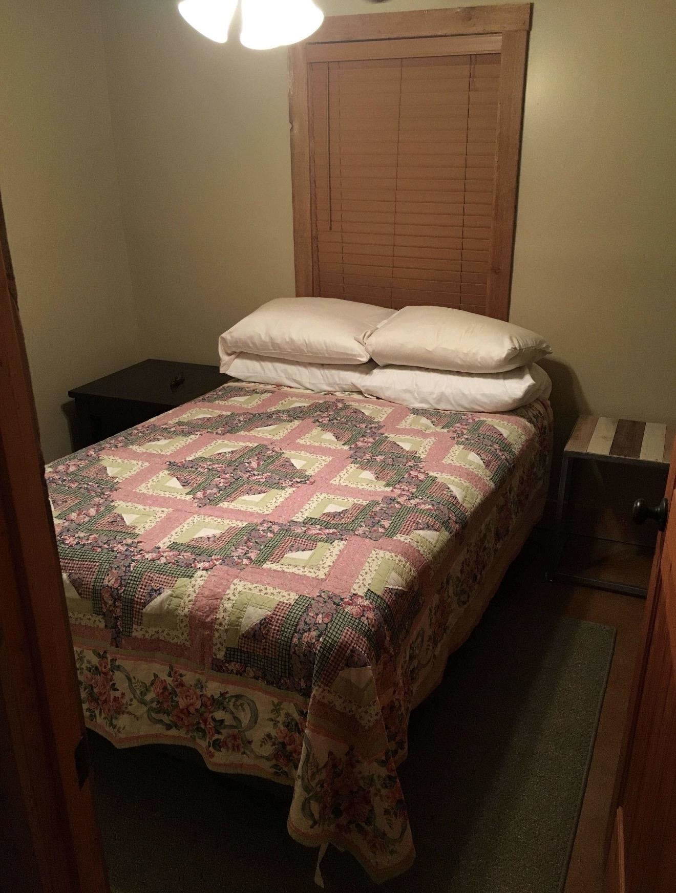 105 Bateman Road Moscow, TN 38057 - Photo 7 of 26 a bed sitting in a bedroom next to a window