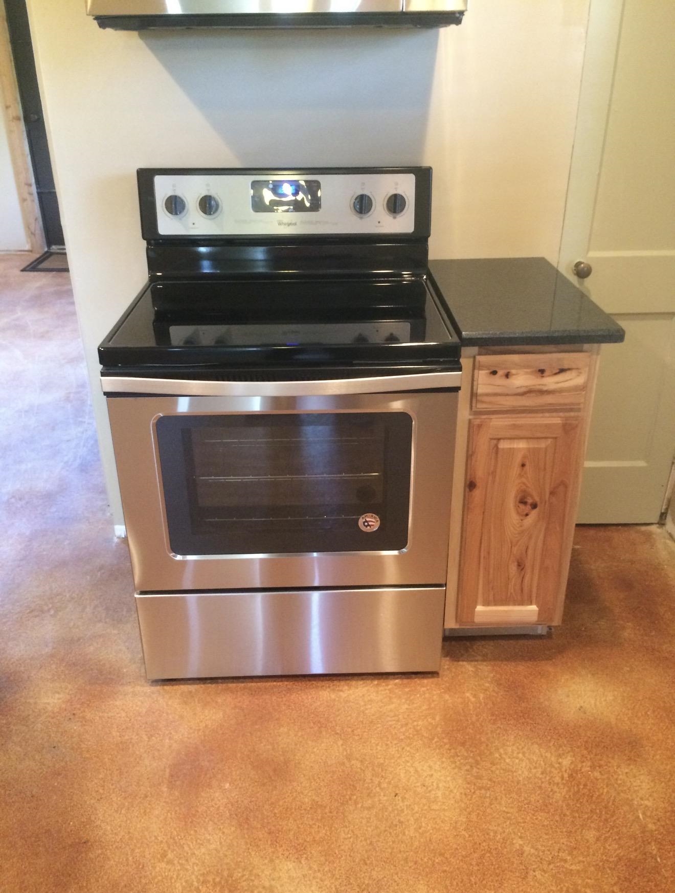 105 Bateman Road Moscow, TN 38057 - Photo 10 of 26 a stove top oven sitting inside of a kitchen