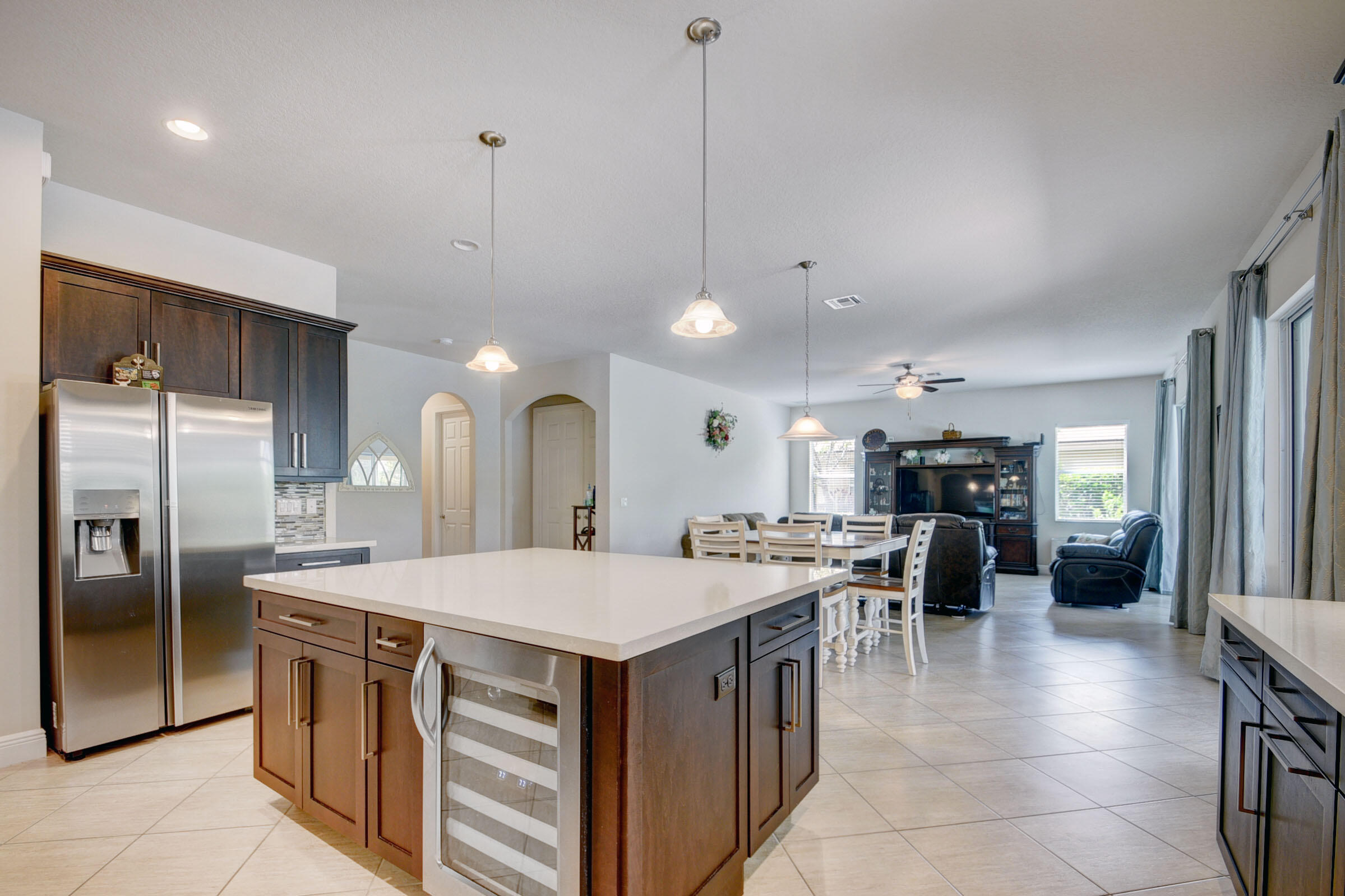 8625 Wellington View Drive Royal Palm Beach, FL 33411 - Photo 12 of 54 a large kitchen with a table and chairs