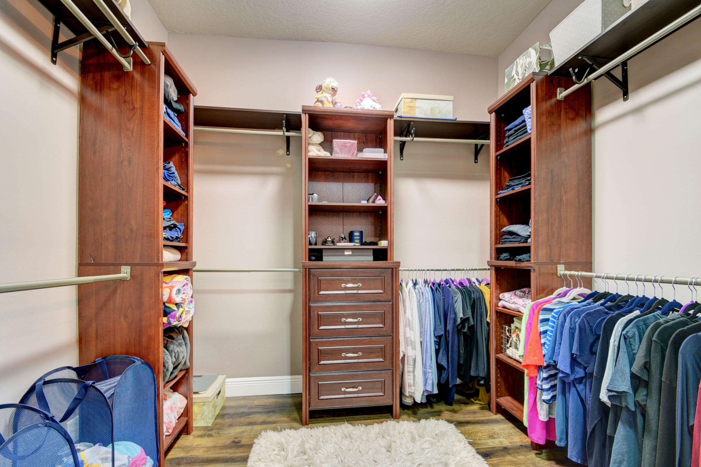 8625 Wellington View Drive Royal Palm Beach, FL 33411 - Photo 27 of 54 a view of walk in closet with clothes and shoes