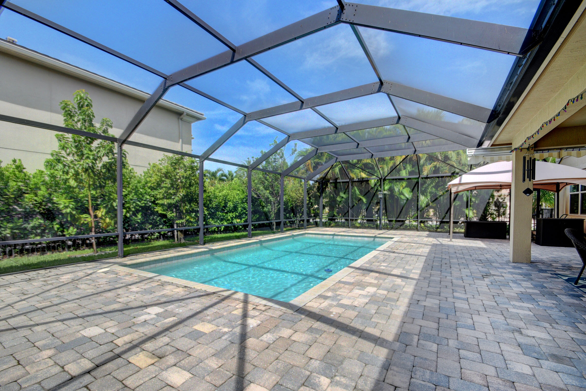 8625 Wellington View Drive Royal Palm Beach, FL 33411 - Photo 40 of 54 a view of a backyard with a small cabin