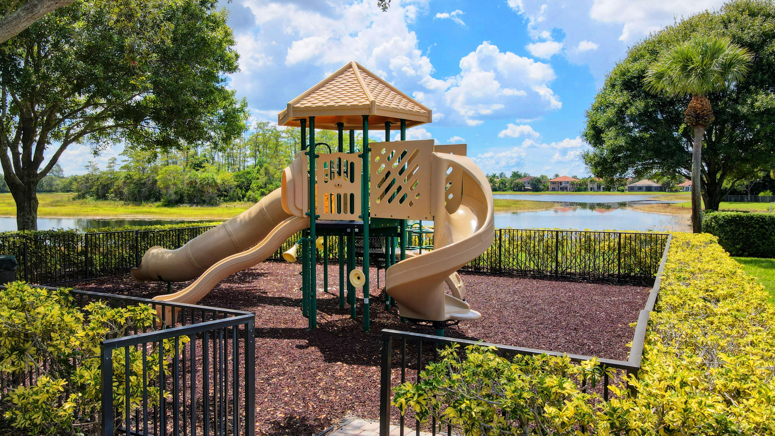 8625 Wellington View Drive Royal Palm Beach, FL 33411 - Photo 48 of 54 a roof deck with table and chairs under an umbrella