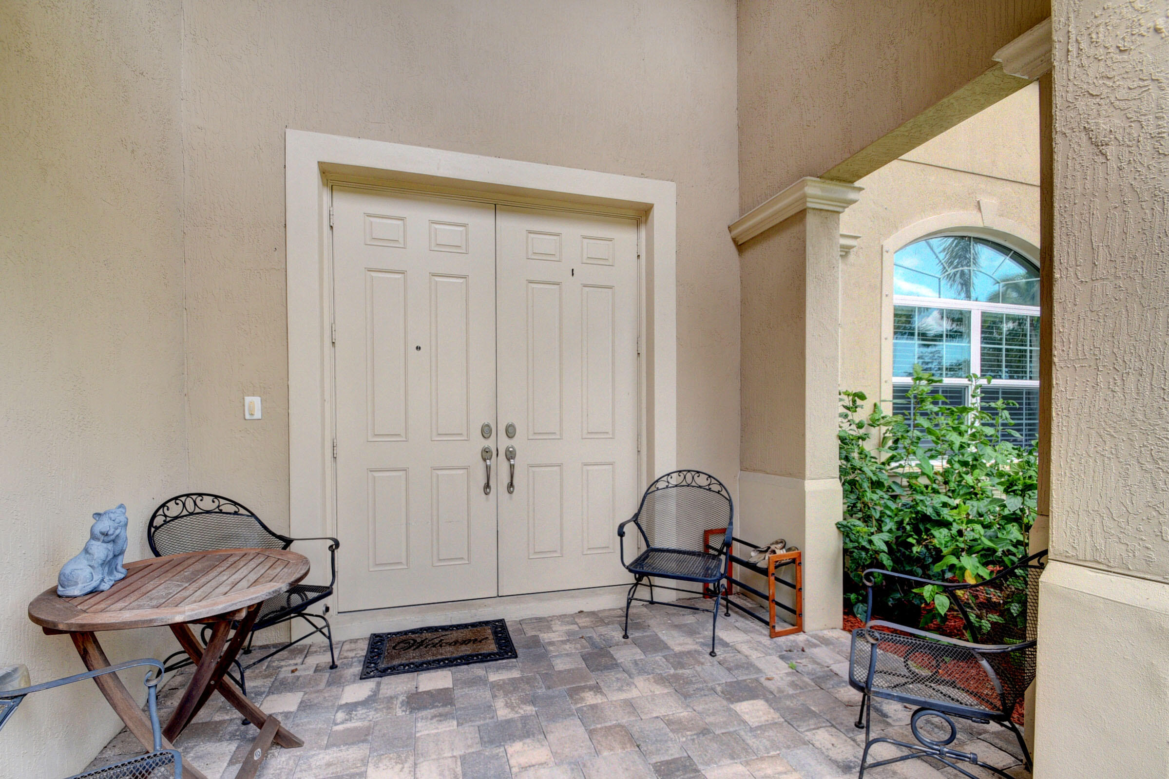 8625 Wellington View Drive Royal Palm Beach, FL 33411 - Photo 5 of 54 a view of a porch with chairs and potted plants