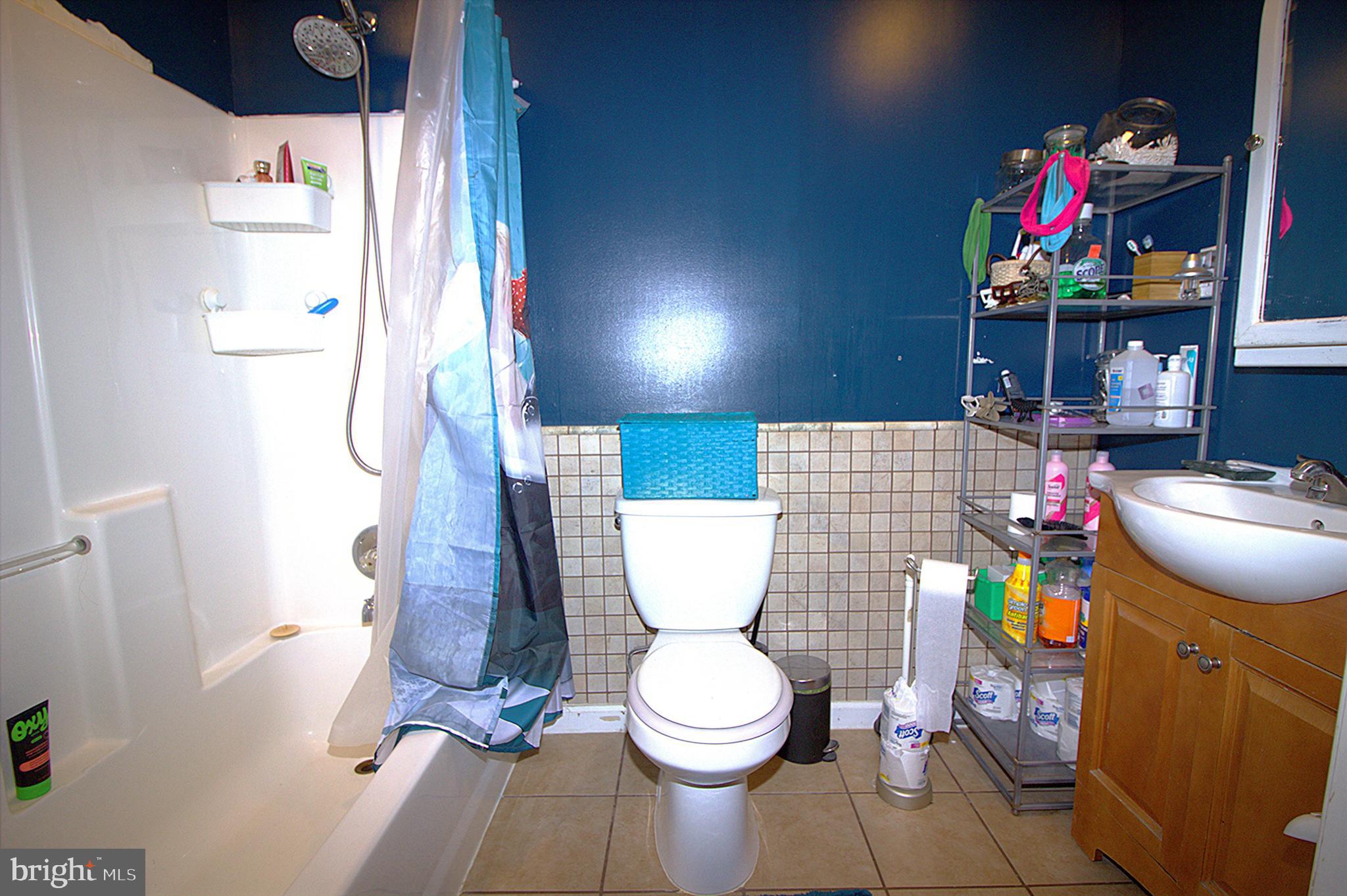 2408 Lodge Farm Road Baltimore, MD 21219 - Photo 4 of 6 a bathroom with a toilet and a sink