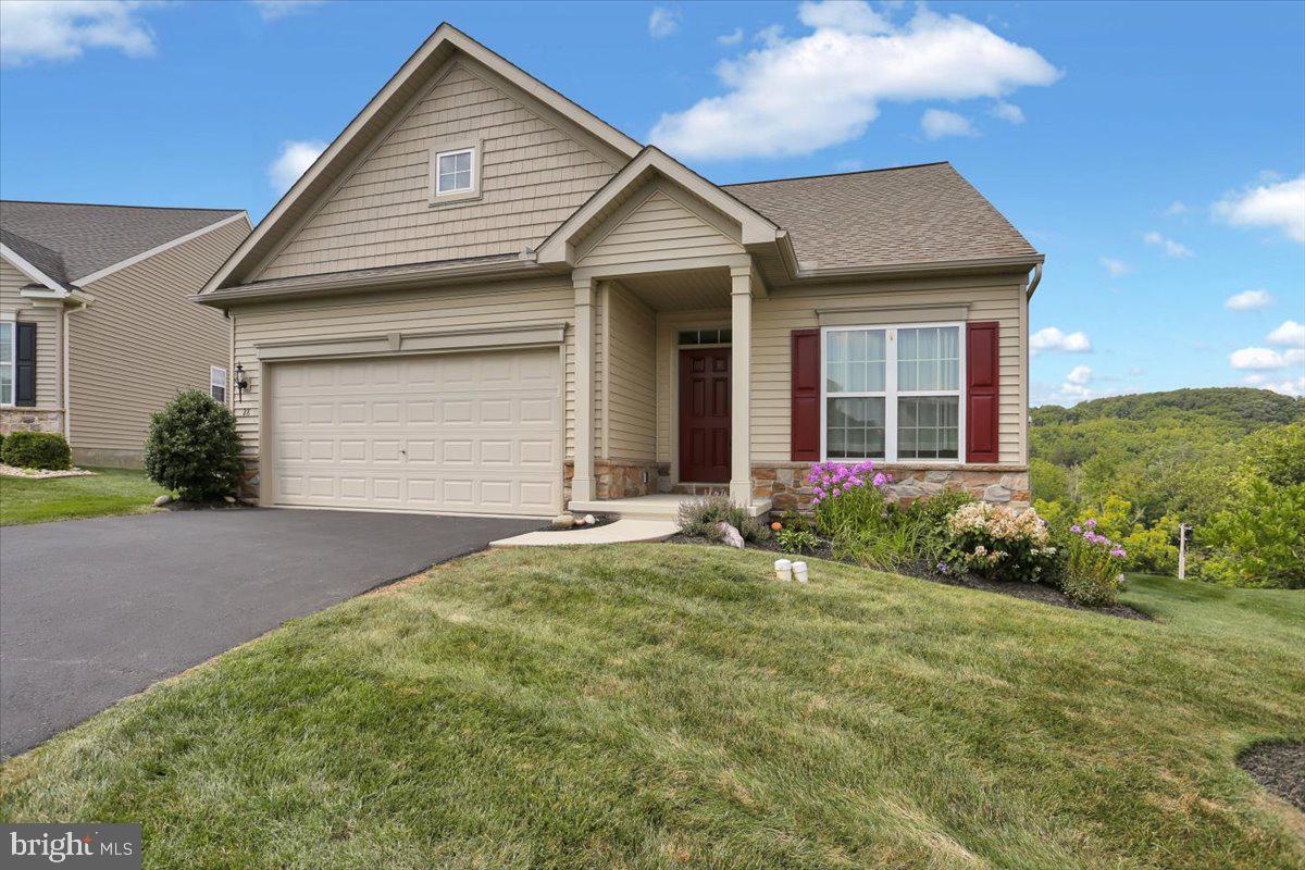 a front view of a house with garden