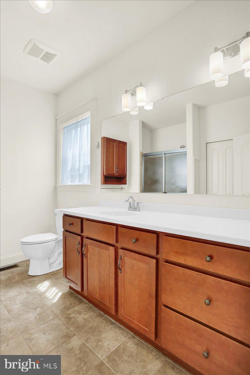 28 Calming Trail Sinking Spring, PA 19608 - Photo 22 of 43 a spacious bathroom with a granite countertop sink and a mirror