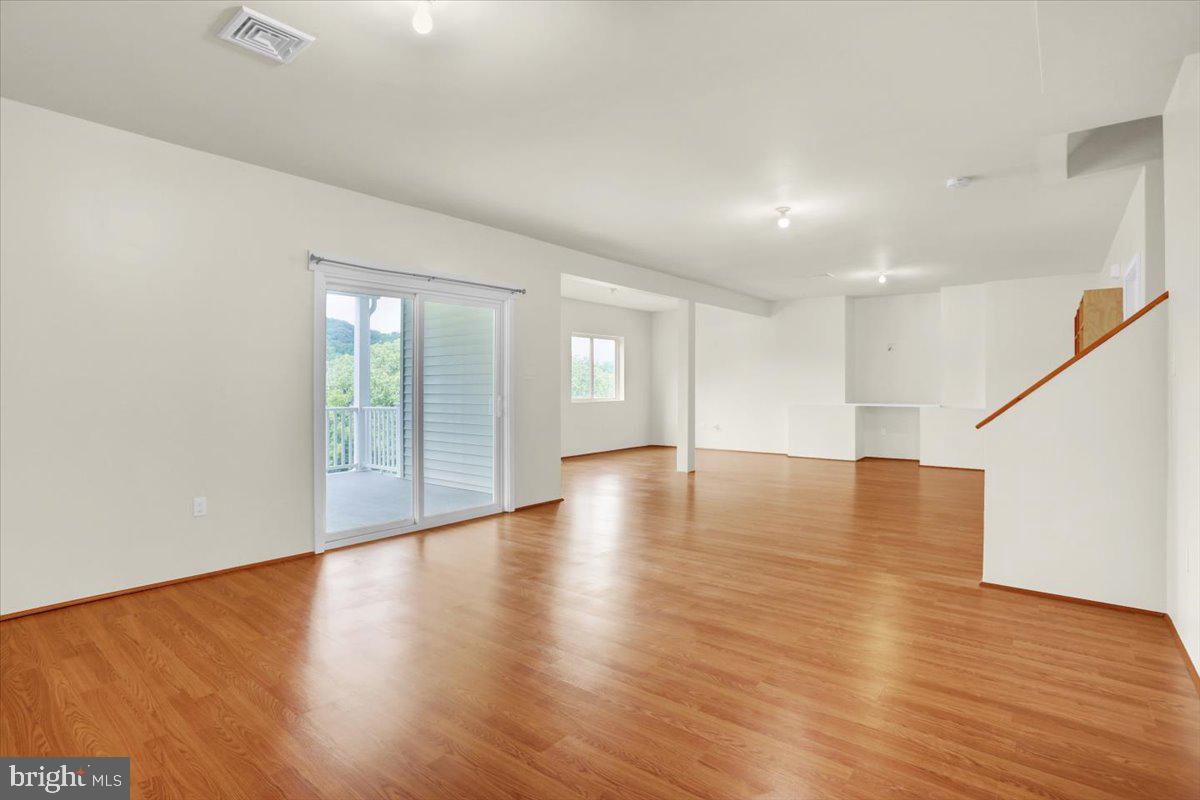 28 Calming Trail Sinking Spring, PA 19608 - Photo 33 of 43 a view of empty room with wooden floor and fan