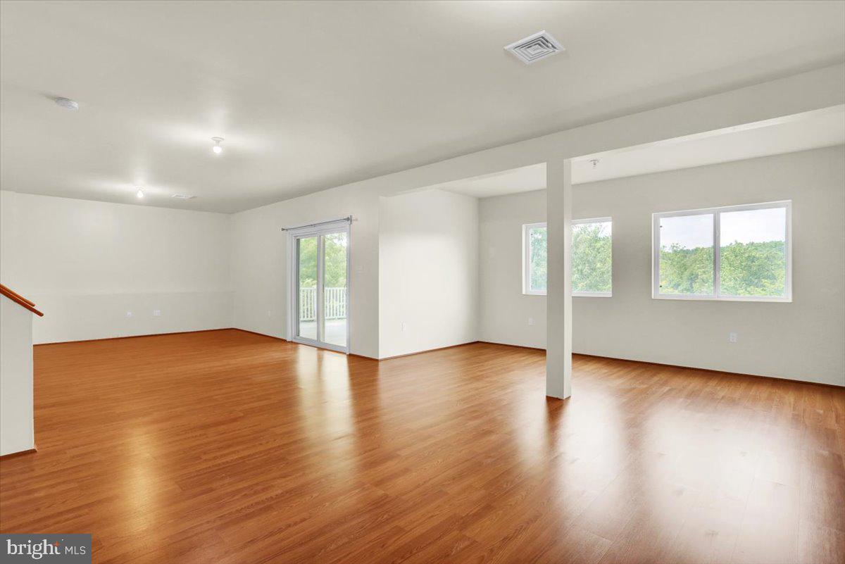 28 Calming Trail Sinking Spring, PA 19608 - Photo 34 of 43 an empty room with wooden floor and windows