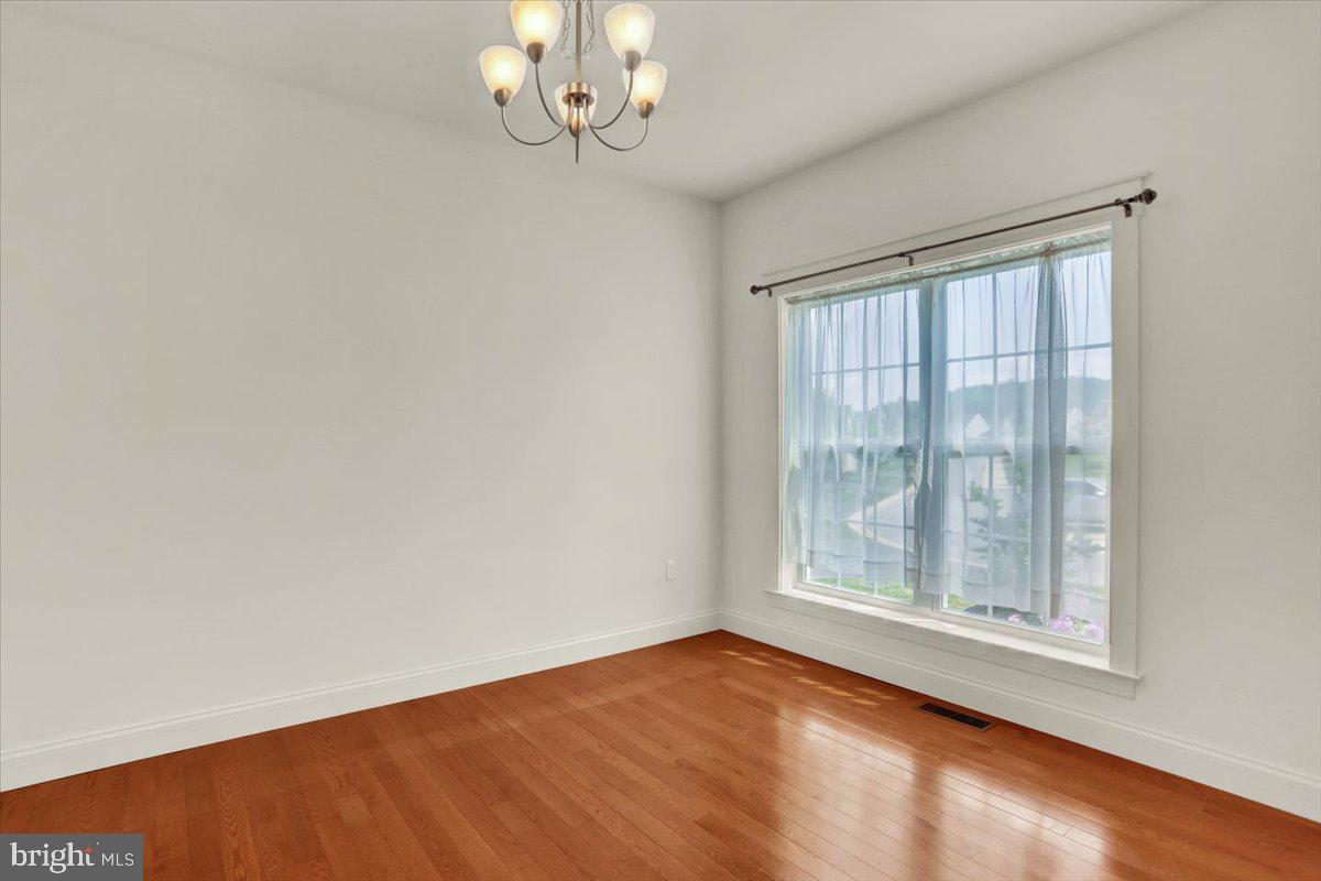 28 Calming Trail Sinking Spring, PA 19608 - Photo 6 of 43 an empty room with wooden floor and windows