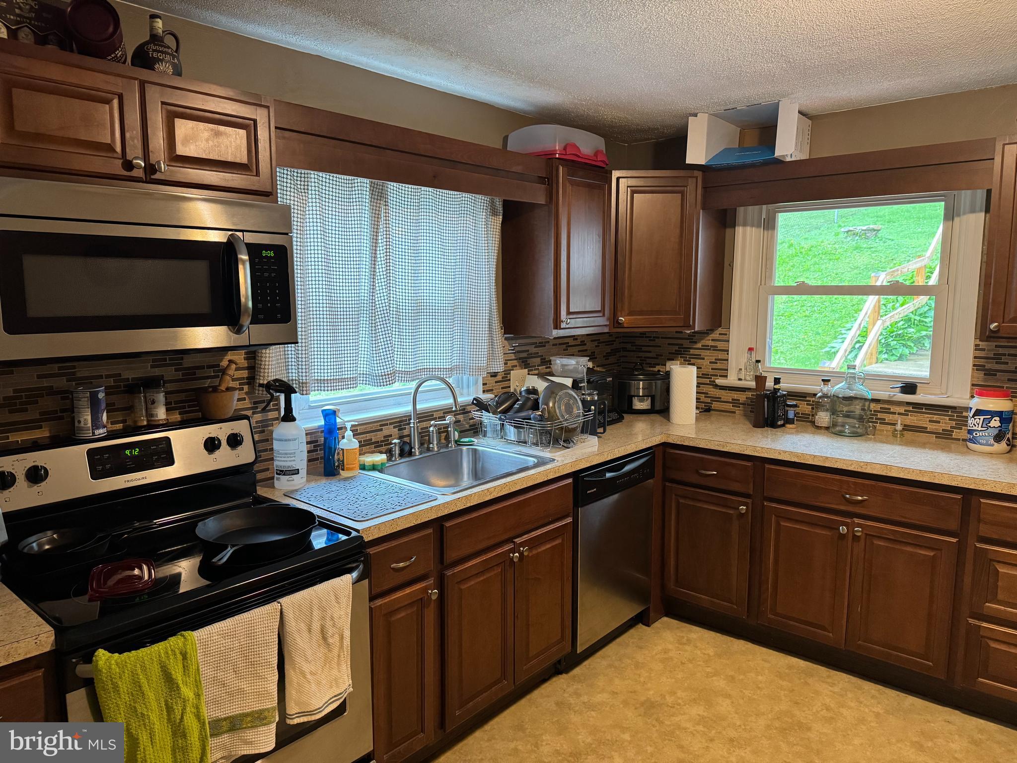 42 Reed Street Mohnton, PA 19540 - Photo 12 of 17 a kitchen with stainless steel appliances a sink stove and microwave