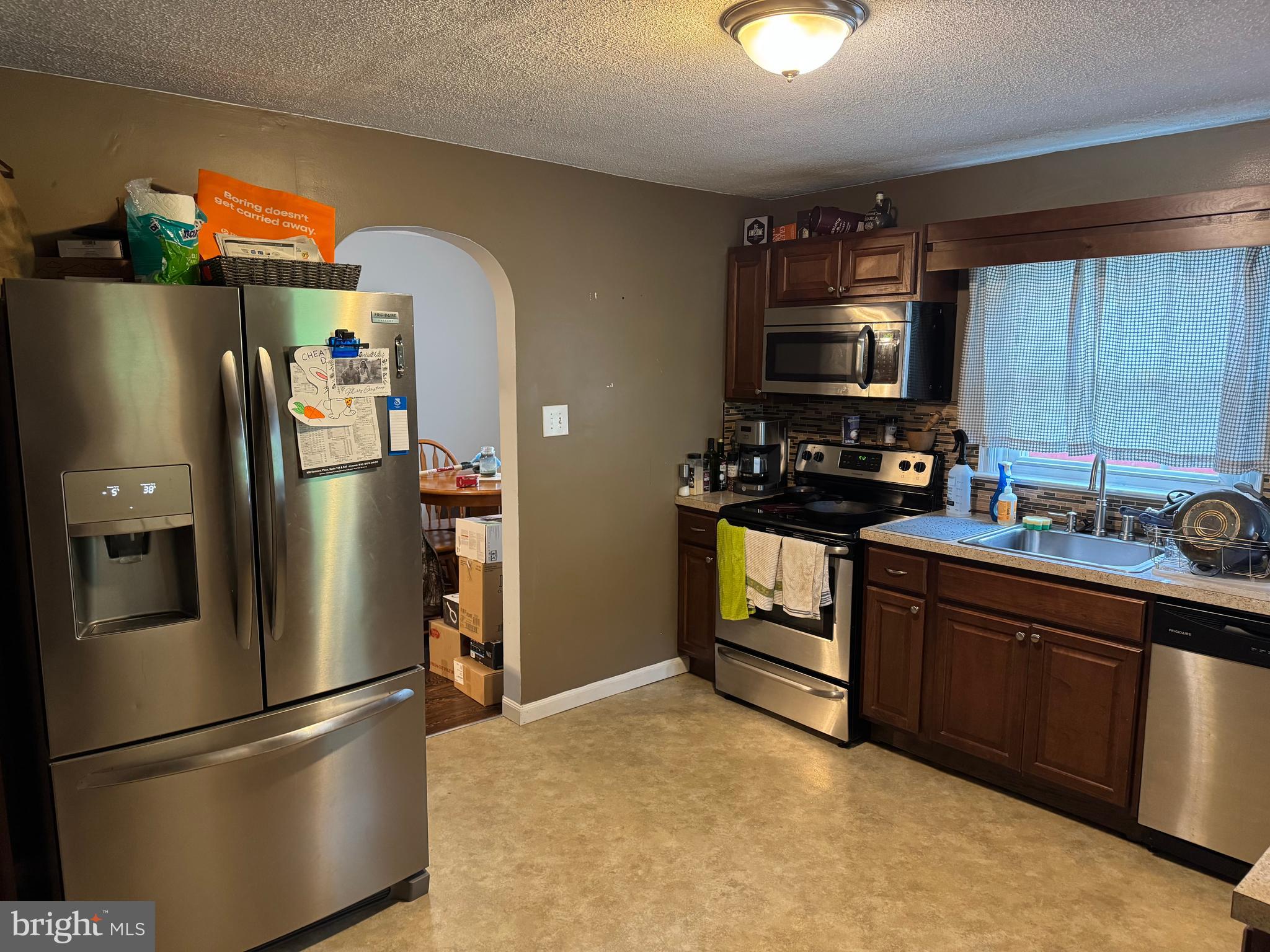 42 Reed Street Mohnton, PA 19540 - Photo 13 of 17 a kitchen with stainless steel appliances granite countertop a refrigerator a stove a sink and a microwave
