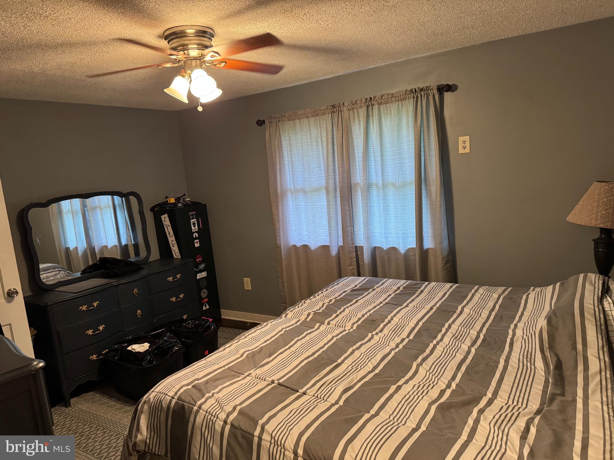 42 Reed Street Mohnton, PA 19540 - Photo 4 of 17 a bedroom with a bed and a chandelier
