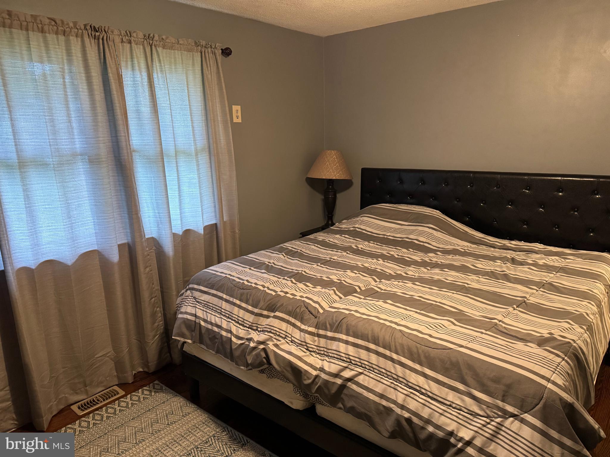 42 Reed Street Mohnton, PA 19540 - Photo 5 of 17 a bedroom with a bed and a window