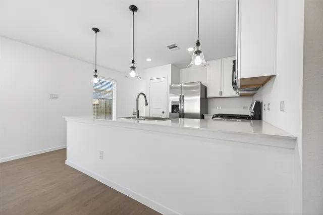a view of kitchen and sink