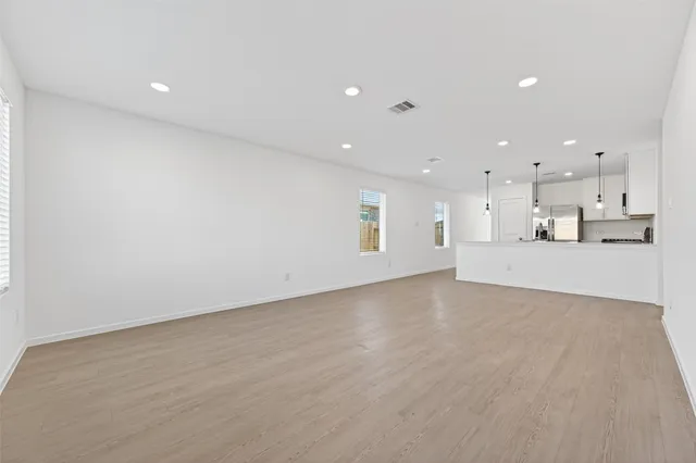 a view of a kitchen with a sink and a microwave