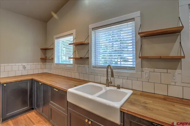 a kitchen with a sink and a window