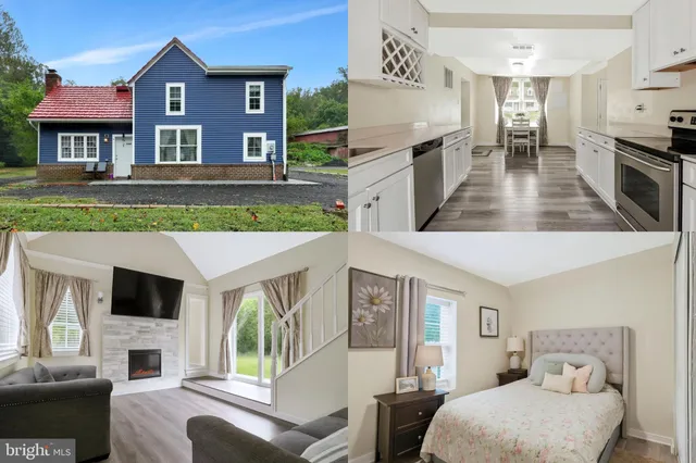 a view of living room kitchen with furniture and a fireplace