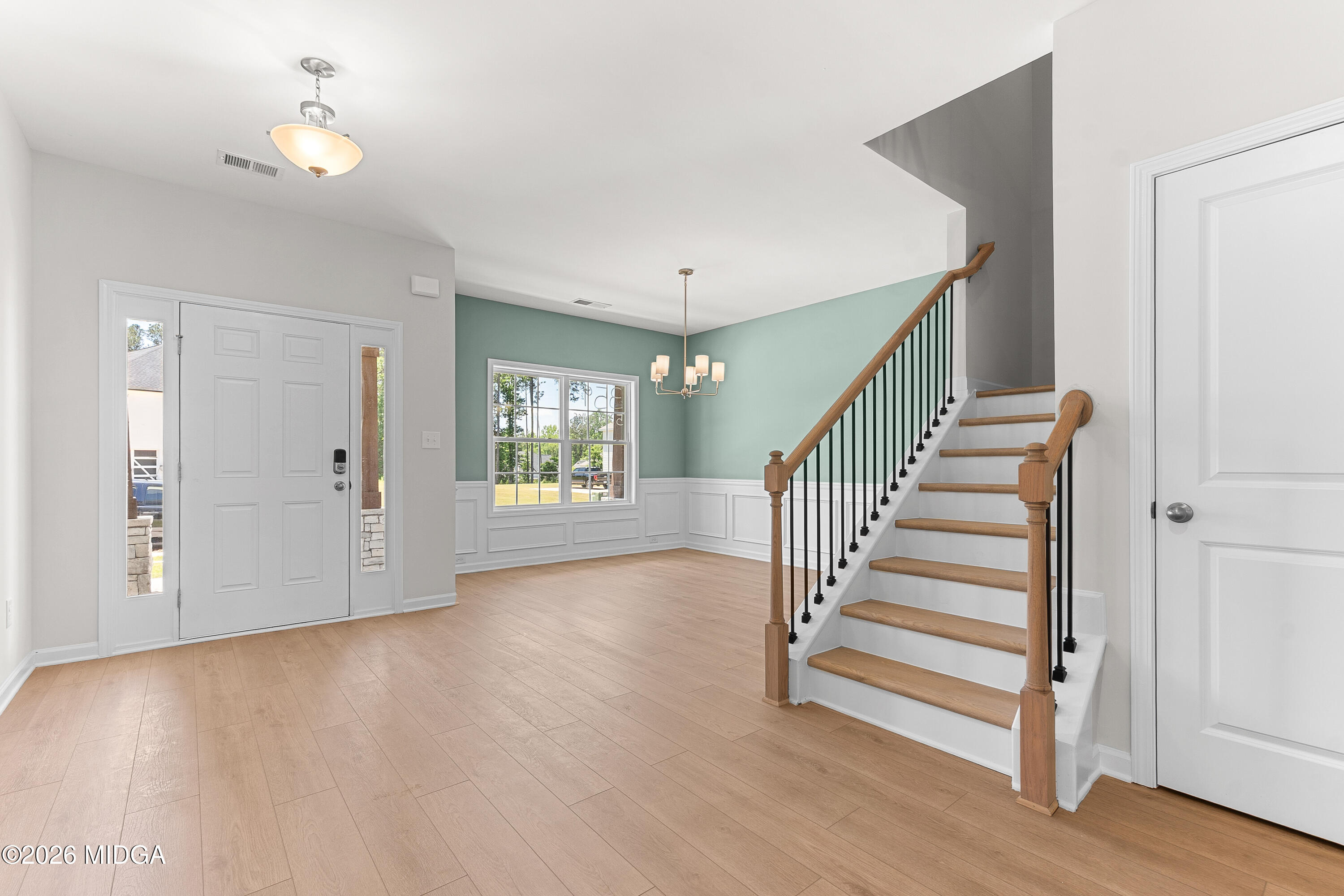 5393 Felles Way, Unit 359 Forsyth, GA 31029 - Photo 4 of 54 a view of an entryway with wooden floor