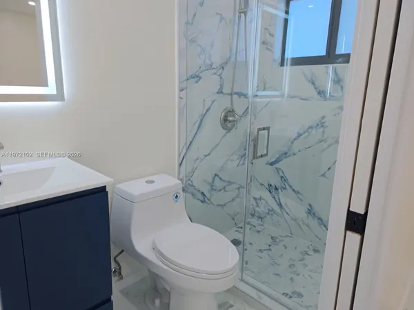 a bathroom with a toilet and a sink
