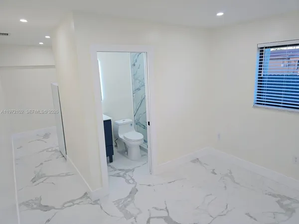 a bathroom with a sink and toilet