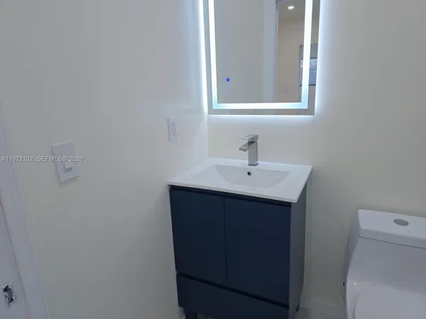 a bathroom with a sink and a toilet