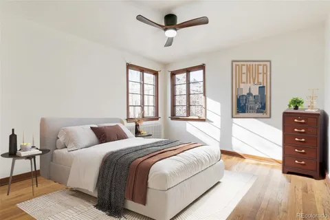 a spacious bedroom with a bed and a dresser