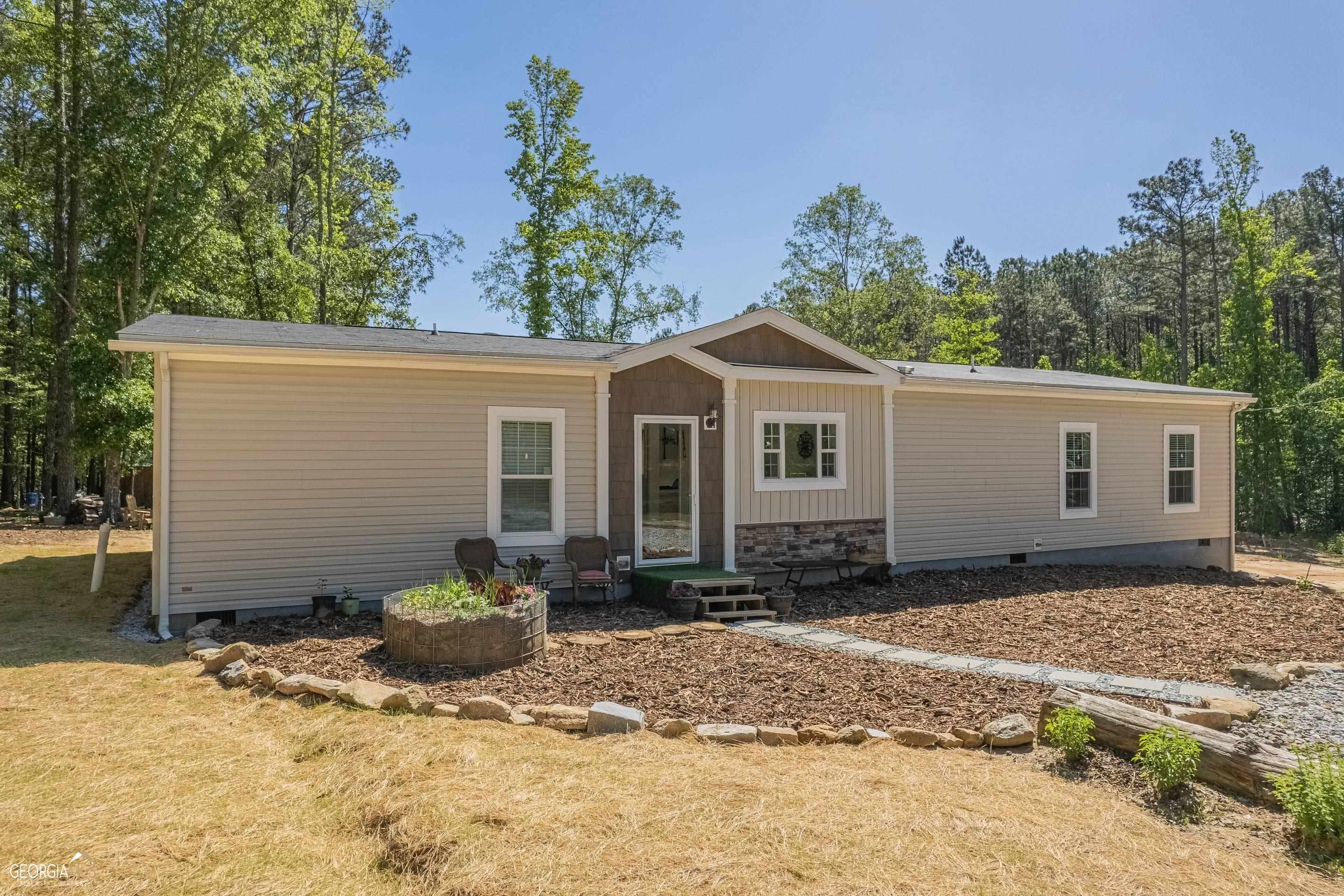 121 Wesley Chapel Road Lexington, GA 30648 - Photo 1 of 1 a view of a house with a yard