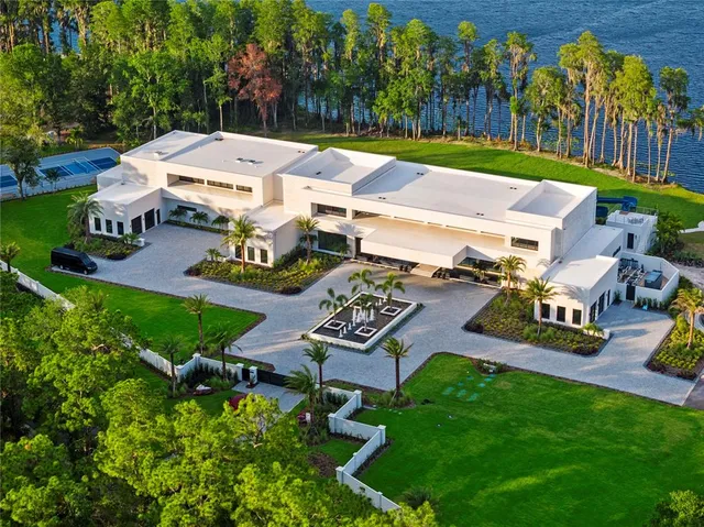 a swimming pool with outdoor seating and yard