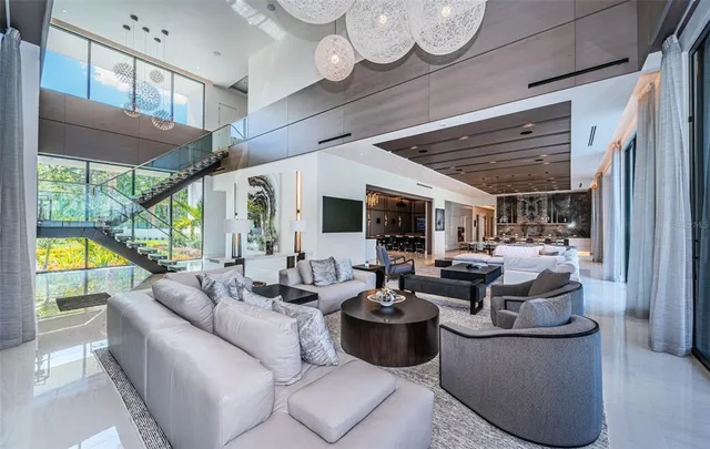 a kitchen with white cabinets and window
