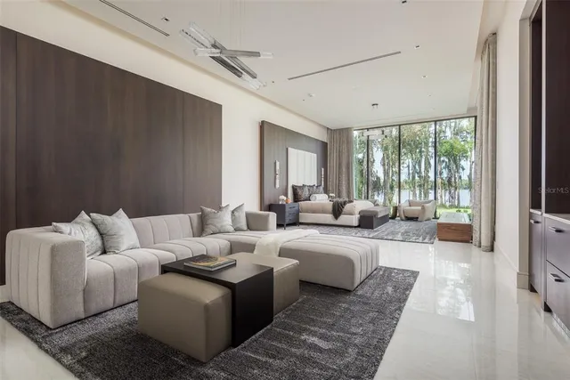 a kitchen with a table chairs and a view of living room