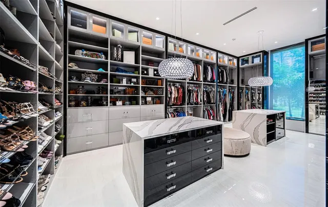 a view of a swimming pool with lounge chairs in the patio