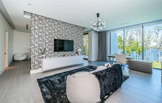 a view of a patio with furniture and wooden floor