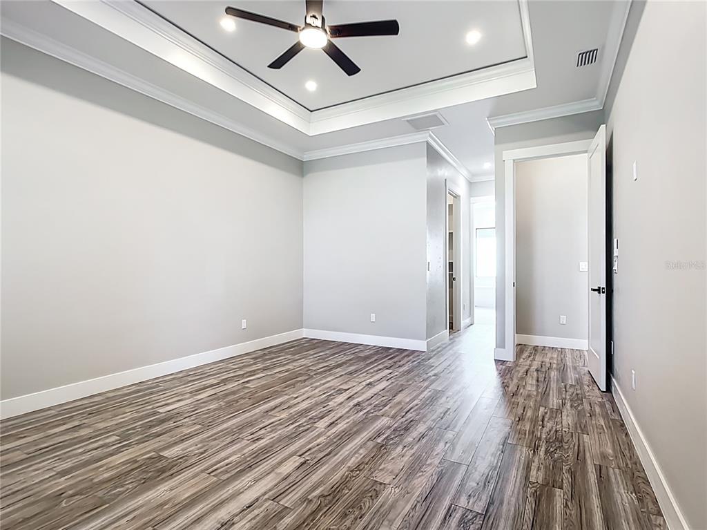 10588 Kidron Avenue Englewood, FL 34224 - Photo 20 of 53 a view of an empty room and wooden floor