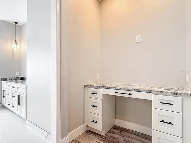a spacious bathroom with bathtub double vanity