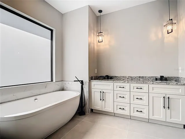 a bathroom with a bathtub and shower