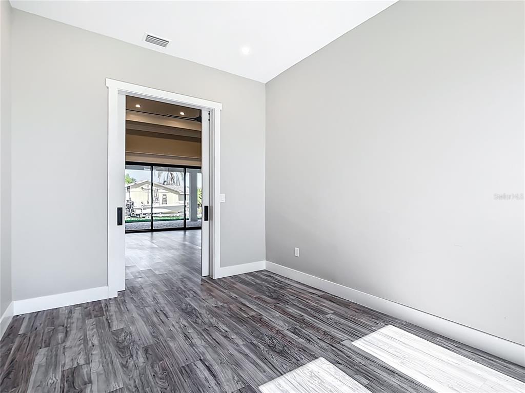 10588 Kidron Avenue Englewood, FL 34224 - Photo 31 of 53 a view of hallway with wooden floor