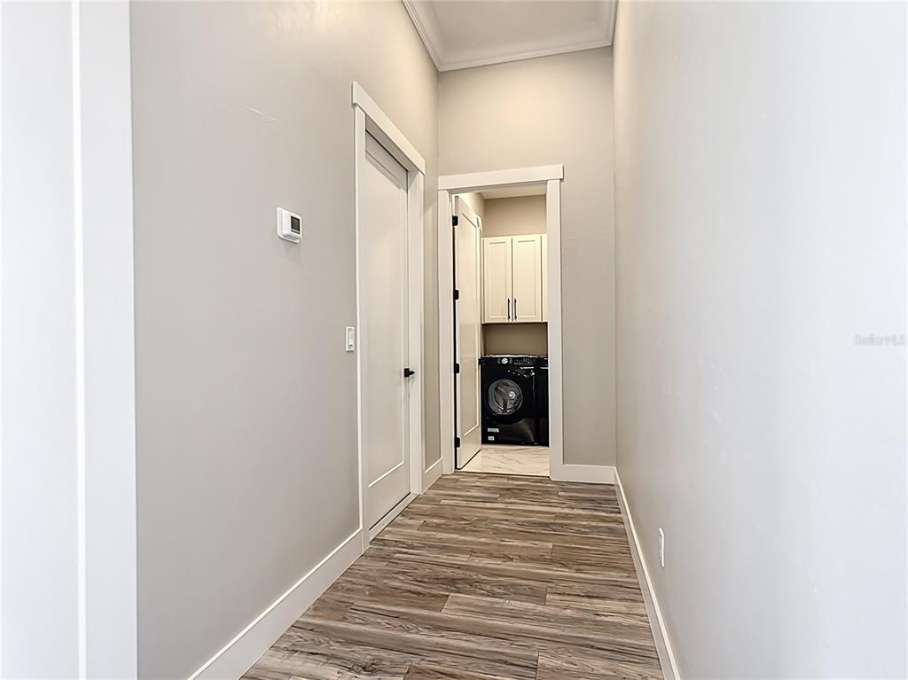 10588 Kidron Avenue Englewood, FL 34224 - Photo 33 of 53 a view of a hallway with wooden floor