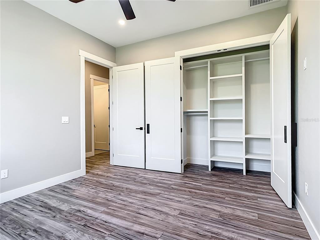 10588 Kidron Avenue Englewood, FL 34224 - Photo 36 of 53 a view of a room with wooden floor and closet