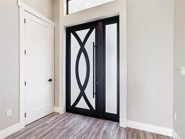 a view of front door with wooden floor