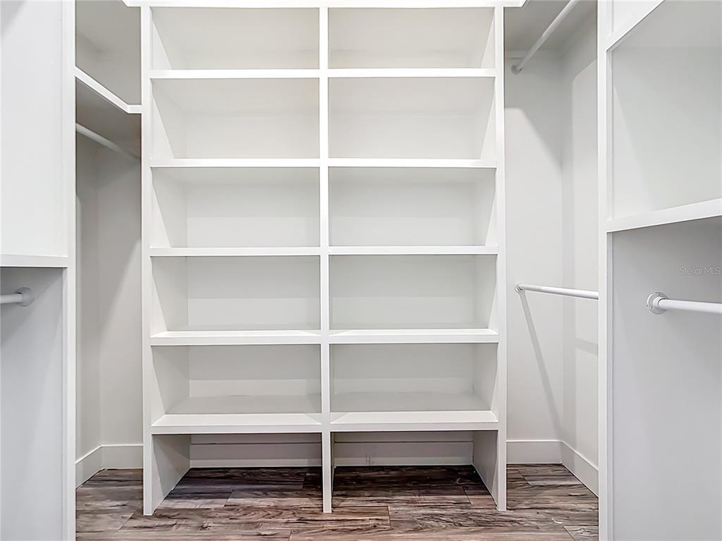 10588 Kidron Avenue Englewood, FL 34224 - Photo 42 of 53 a view of walk in closet with empty racks