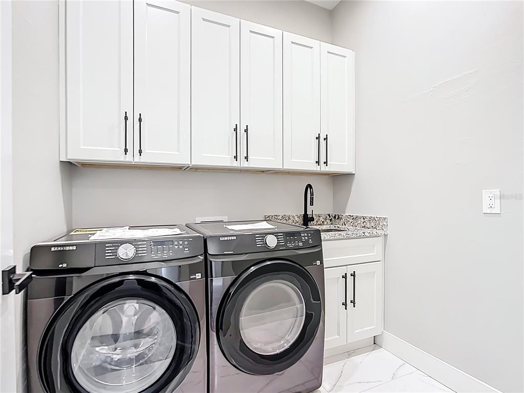 10588 Kidron Avenue Englewood, FL 34224 - Photo 43 of 53 a utility room with dryer and washer