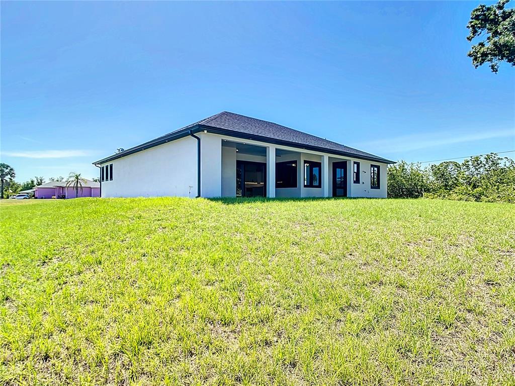 10588 Kidron Avenue Englewood, FL 34224 - Photo 49 of 53 a view of a house with yard and sitting area