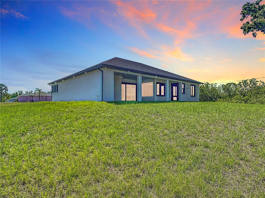 10588 Kidron Avenue Englewood, FL 34224 - Photo 50 of 53 a view of a house with a yard