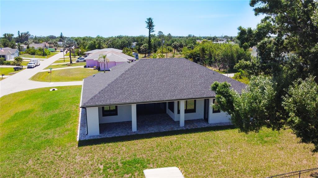 10588 Kidron Avenue Englewood, FL 34224 - Photo 51 of 53 a aerial view of a house with swimming pool and big yard