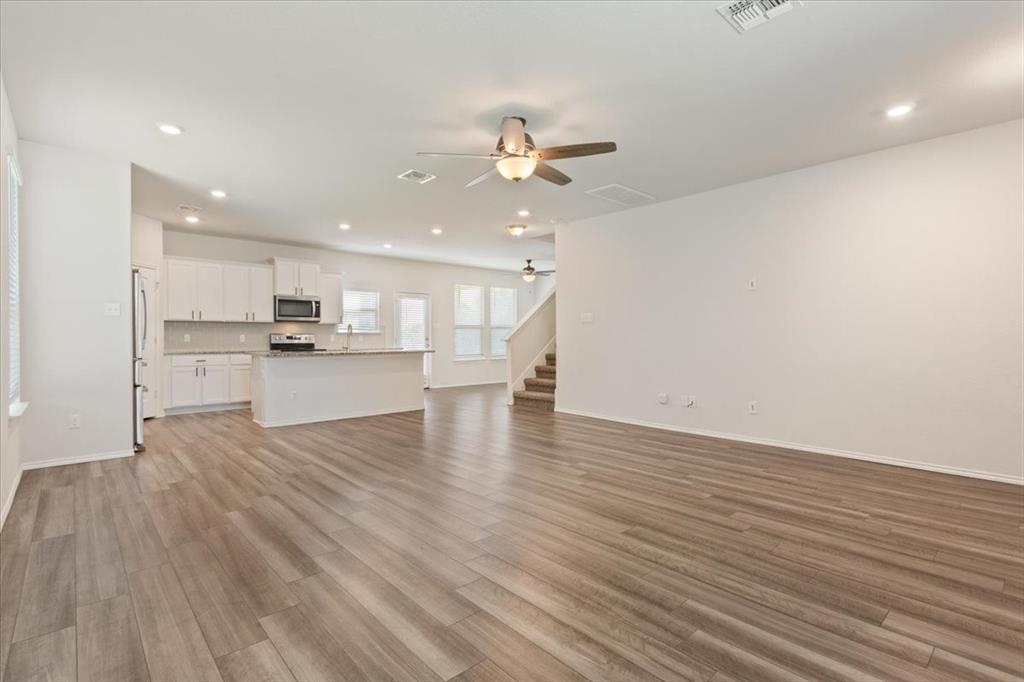 6317 Elephant Butte Drive Waco, TX 76708 - Photo 7 of 39 Open-concept living space with wood-finish flooring
