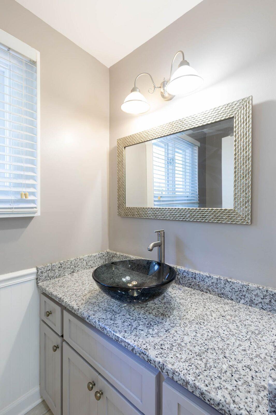 5831 Cane Ridge Road Antioch, TN 37013 - Photo 12 of 30 a bathroom with a granite countertop sink and a mirror