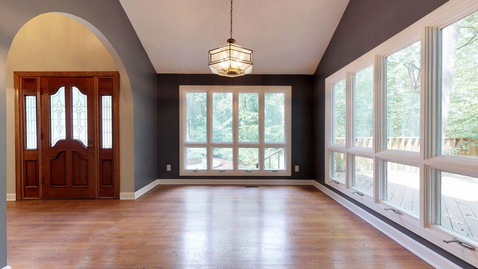 5831 Cane Ridge Road Antioch, TN 37013 - Photo 14 of 30 a view of an empty room with wooden floor and a window