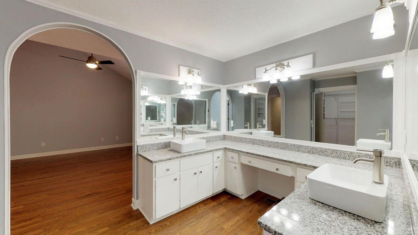 5831 Cane Ridge Road Antioch, TN 37013 - Photo 19 of 30 a bathroom with a double vanity sink and a mirror